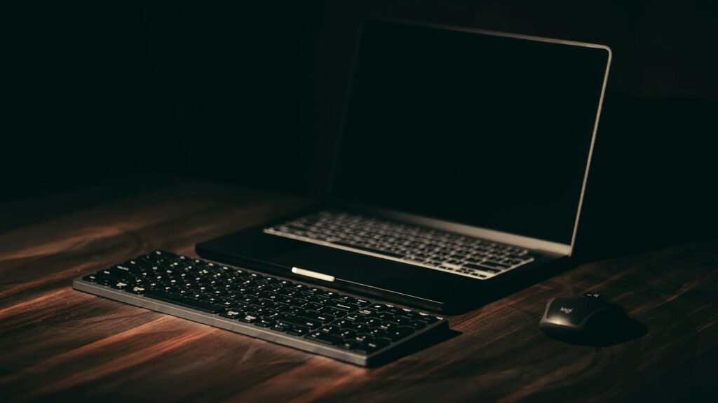 Compact keyboard with mouse placed close on an organized desk
