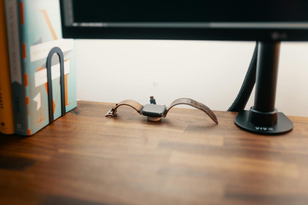 A monitor arm with cables routed in a controlled loop that allows movement without sagging.