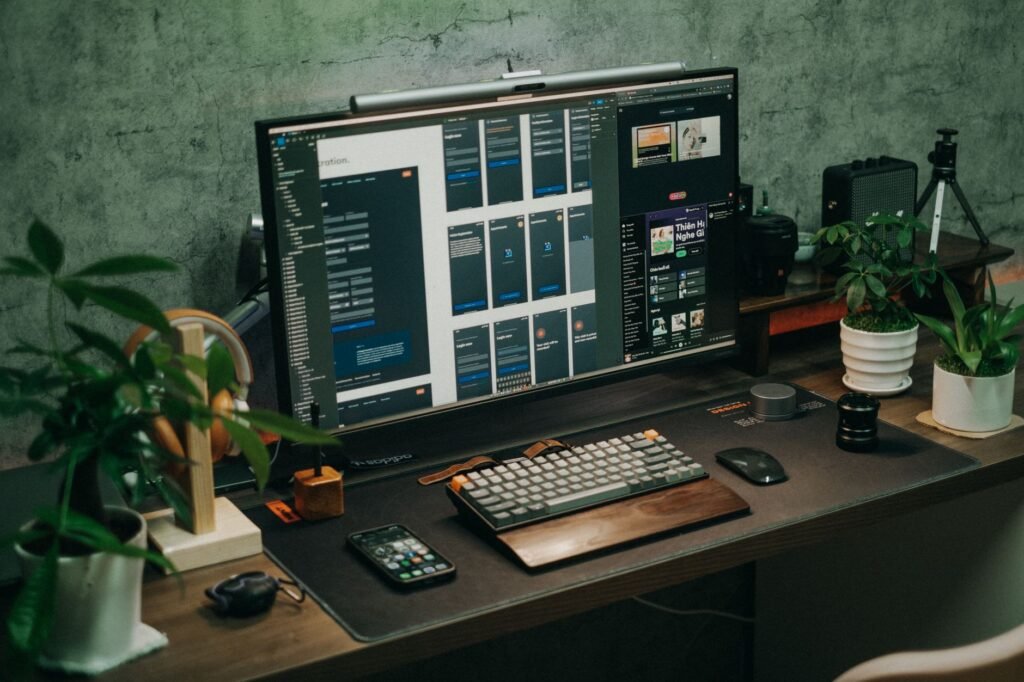 A neatly arranged desk with a monitor at eye level and keyboard and mouse placed close together
