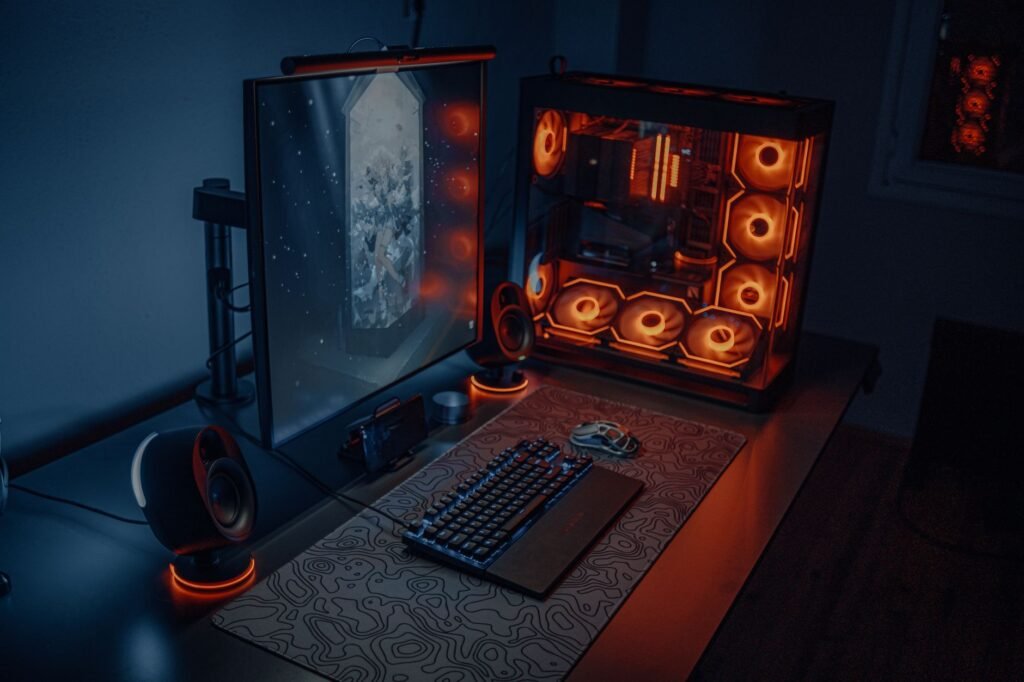 Minimal gaming desk with one monitor, soft backlighting, and hidden cables