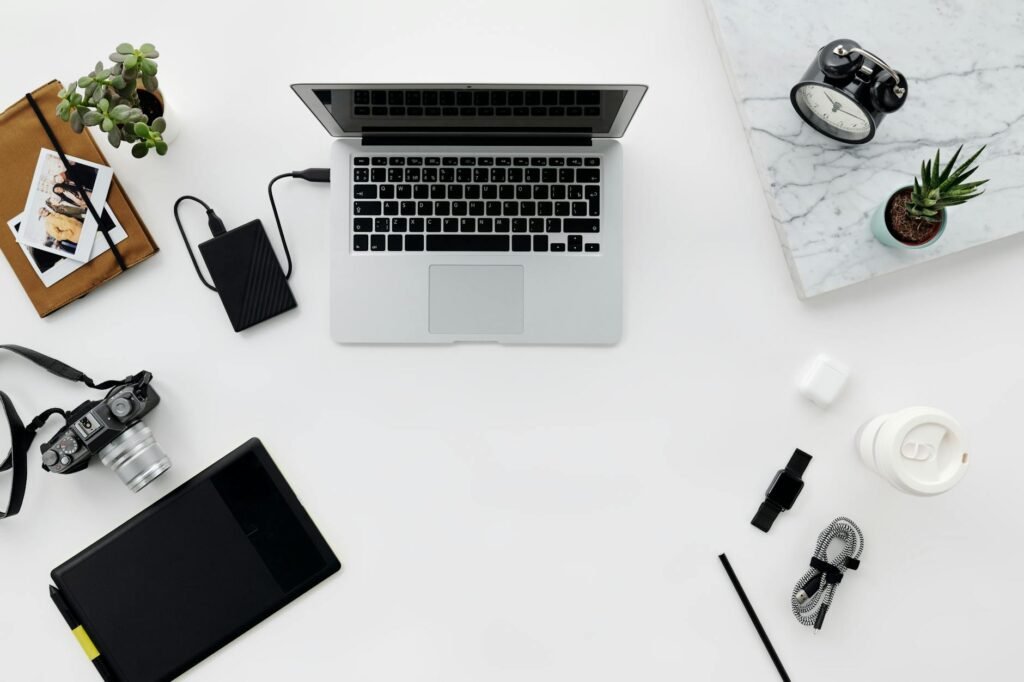 A laptop connected to an external drive on an organized desk
